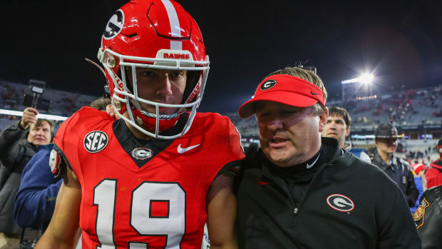 Nov 25, 2023; Atlanta, Georgia, USA; Georgia Bulldogs tight end Brock Bowers (19) and head coach Kirby Smart walk off the field after defeating the Georgia Tech Yellow Jackets at Bobby Dodd Stadium at Hyundai Field. (Brett Davis / USA TODAY Sports).